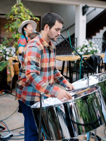 A steel drum player at Collen & Christian's Wedding Reception in the courtyard at Frequency Wine Company in Santa Barbara, California