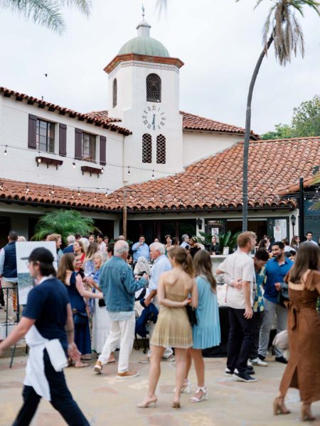 A view of the crowd at Collen & Christian's Wedding Reception in the courtyard at Frequency Wine Company in Santa Barbara, California