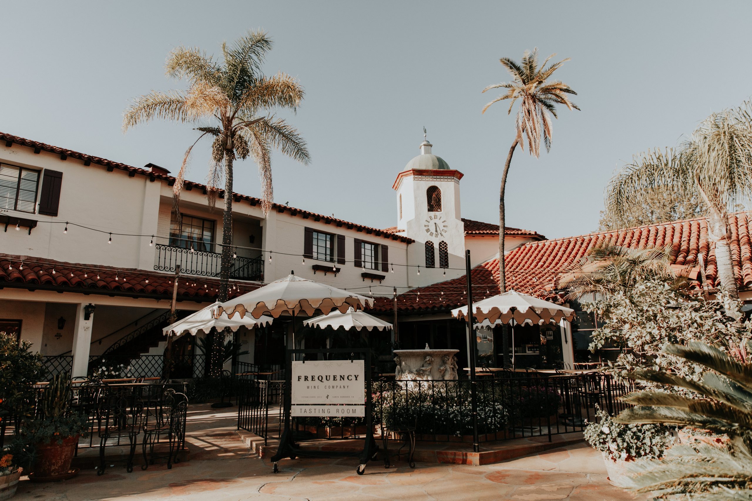 The sunlit courtyard at Frequency Wine Company in downtown Santa Barbara