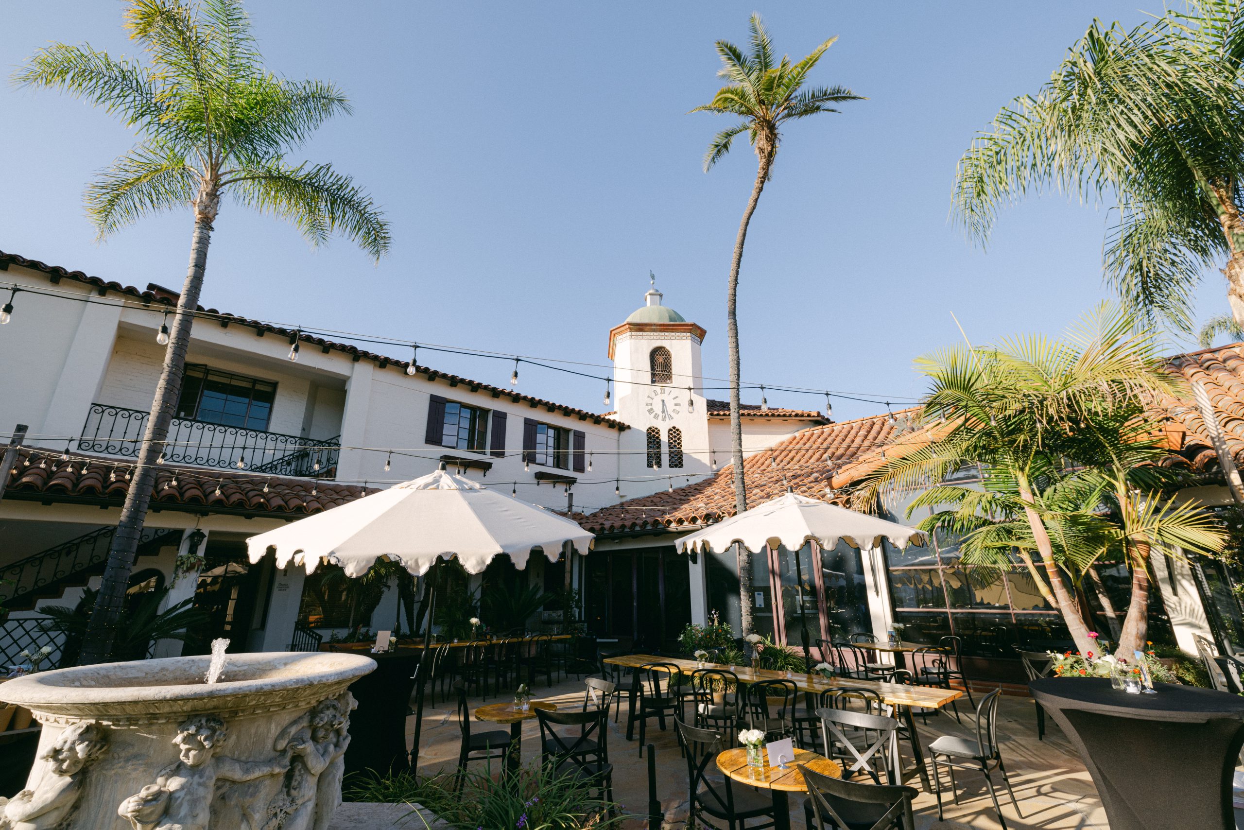 The complete clocktower and sunlit courtyard at Frequency Wine Company