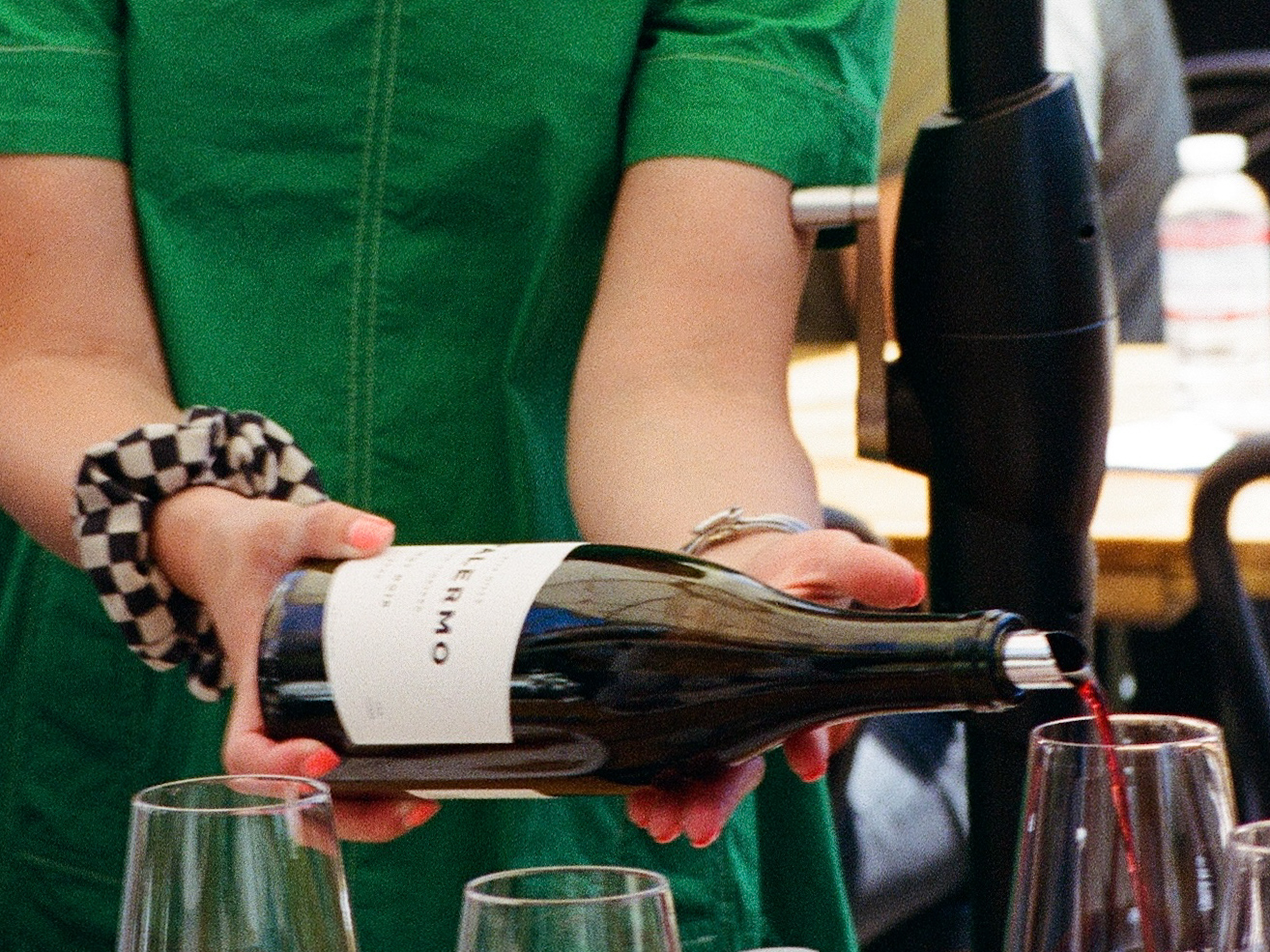DiPALERMO wine being poured into a glass at Frequency’s tasting room